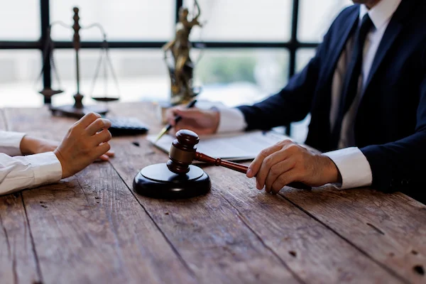 An Atlanta personal injury lawyer at H Groves Law meets with a client.