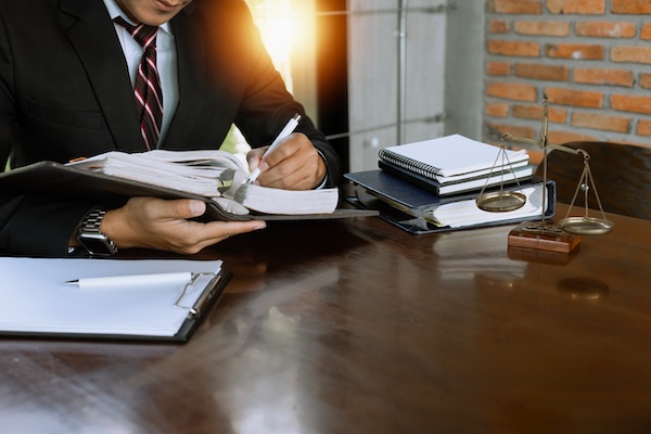Person reviewing documents while preparing a personal injury claim